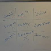 nought and crosses on white board  